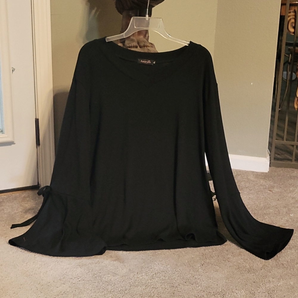 Black sweater, bell sleeves with ties.